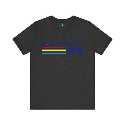 The 1980s Commodore 64 Computer C64 Unisex Jersey Short Sleeve Tee from Printify features a green T-shirt adorned with a vintage design showcasing the text "Commodore 64" and multicolored horizontal lines next to it. The word "Commodore" is emblazoned in blue alongside the Commodore logo, while the number "64" is also highlighted in blue on the right. Ideal for any retro tech enthusiast, this shirt is displayed against a white background.