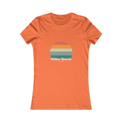 The Printify Women's Favorite Tee - Miller Beach Gary, IN Retro Sunset is a pink women's T-shirt showcasing a retro-style graphic of a sun with horizontal stripes in orange, yellow, and green. Designed with a feminine fit, the airlume combed cotton fabric offers premium softness. Below the sun, the text reads "Miller Beach" in white, with smaller text underneath that is not legible.