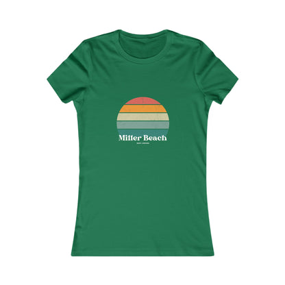 The Printify Women's Favorite Tee - Miller Beach Gary, IN Retro Sunset is a pink women's T-shirt showcasing a retro-style graphic of a sun with horizontal stripes in orange, yellow, and green. Designed with a feminine fit, the airlume combed cotton fabric offers premium softness. Below the sun, the text reads "Miller Beach" in white, with smaller text underneath that is not legible.