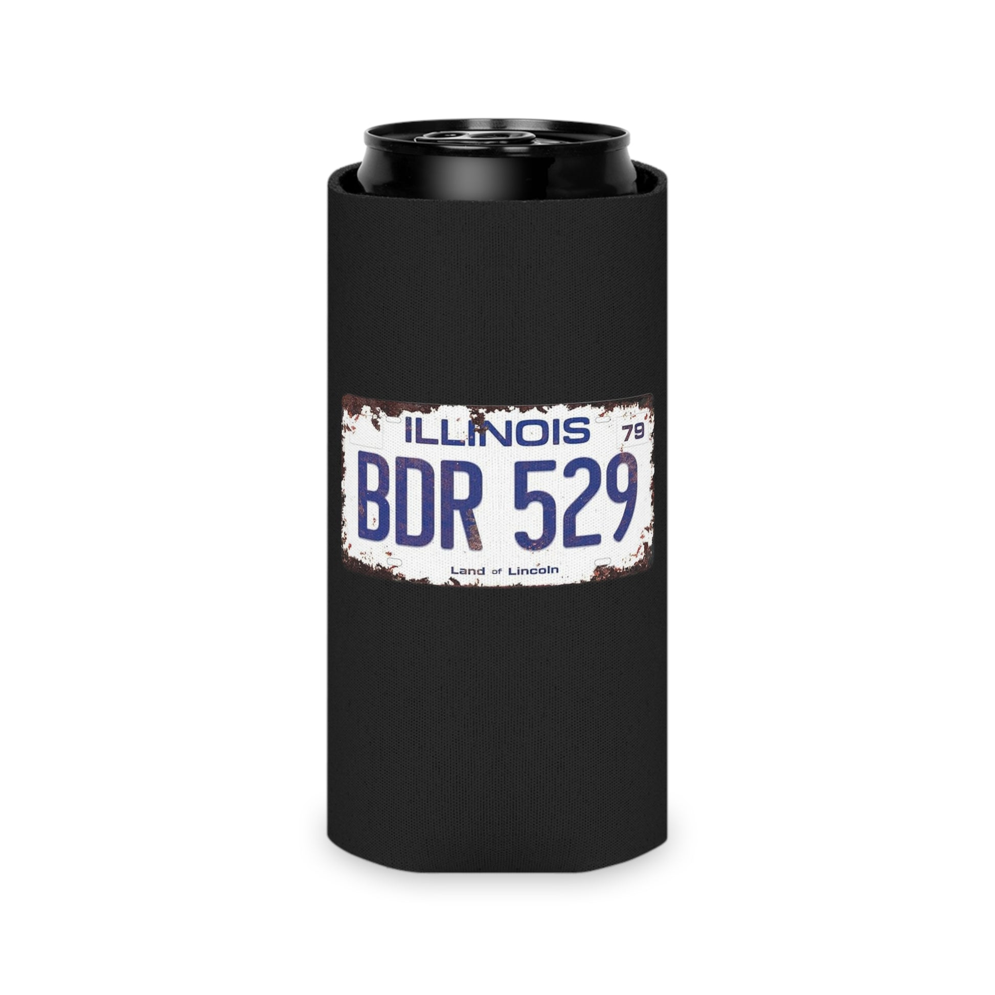 Printify's Blues Brothers - BDR 529 - Koozie is a black beverage can cooler that features a vintage Illinois license plate with "BDR 529" and "Land of Lincoln" on its front, evoking a road-trip vibe. At the bottom, a red circle with a blue lightning bolt symbol completes this stylish koozie.