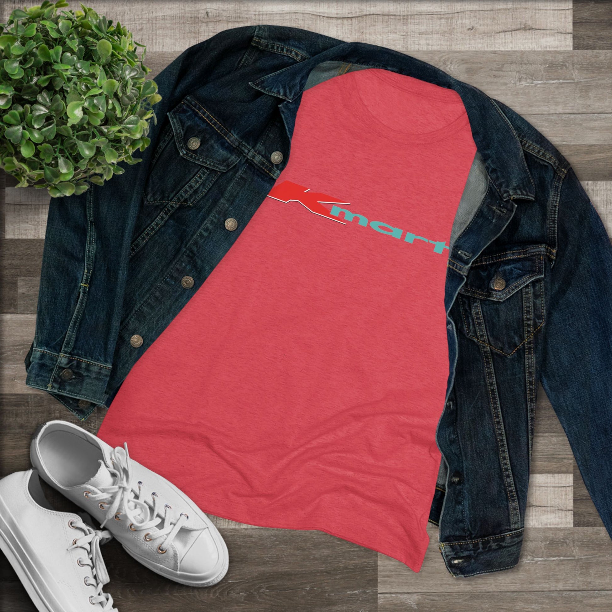 A women's triblend tee by Printify in light gray, featuring a casual and minimalist design that captures the essence of vintage style with a centered 1980s Retro Kmart logo on the front.