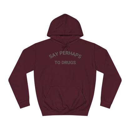 The "Say Perhaps to Drugs - Unisex College Hoodie" by Printify is a maroon hoodie made from soft Airlume cotton. It showcases the phrase "SAY PERHAPS TO DRUGS" in gray across the chest, and features a collegiate design with a front pocket and drawstring hood for enhanced comfort and style.