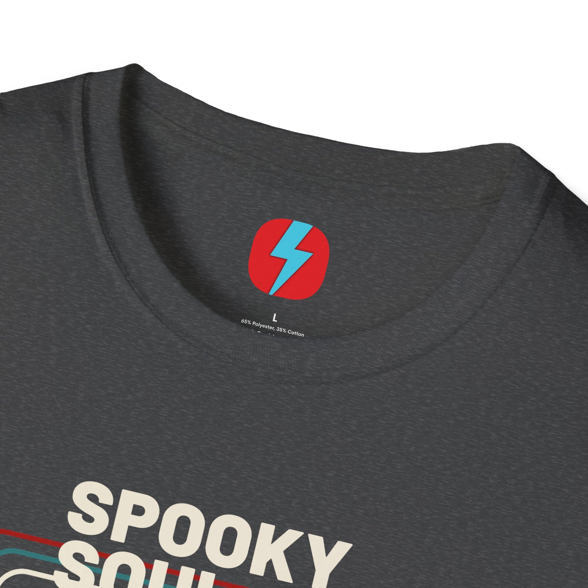 The Spooky Soul - Halloween - Unisex Softstyle T-Shirt by Printify, available in dark gray, showcases a retro-style graphic of a mummy dancing with two kids in Halloween costumes. The text "SPOOKY SOUL" is displayed above the image, which is framed by red and blue lines to enhance its vintage feel.