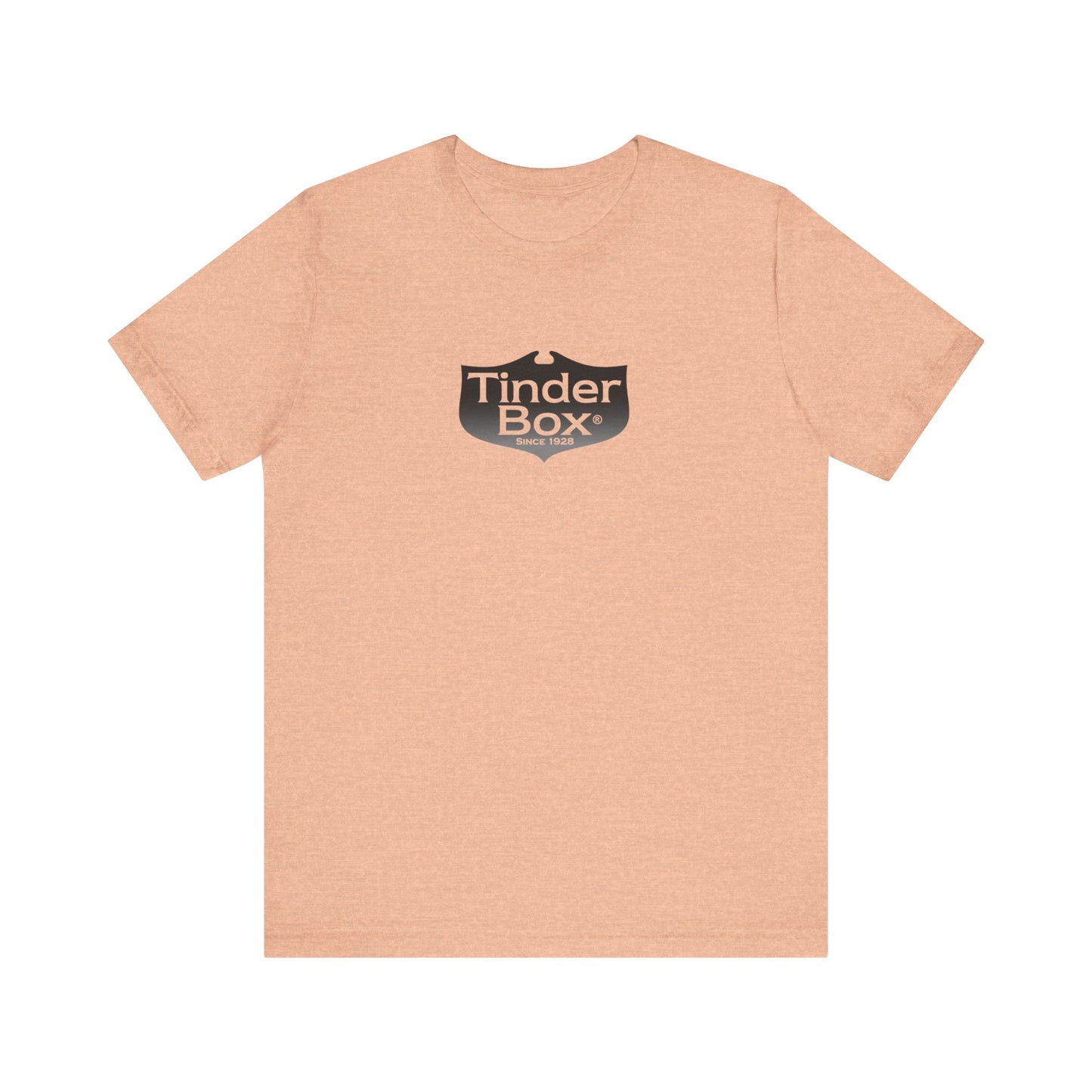 A light blue Printify "The Tinder Box 1980s" unisex jersey short sleeve tee featuring the "Tinder Box" logo in the center. The logo consists of a dark shield with the words "Tinder Box" in white text, with a small flame icon replacing the dot above the "i".