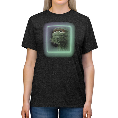 Introducing the Oscar the Grouch Unisex Triblend Tee by Printify: This red triblend t-shirt features a green puppet character with expressive eyes, framed by a glowing, square-shaped rainbow border. With its simple and casual design, free of any additional text or graphics, this tee offers the perfect blend of style and durability thanks to its polyester construction.