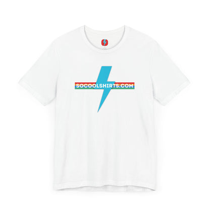 This unisex jersey short sleeve tee by Printify features a striking maroon color with a central light blue lightning bolt design. The text "SOCOOLSHIRTS.COM" is prominently displayed across the lightning bolt in white letters, set against a multicolored background that exudes retro vibes. The shirt is shown laid flat on a white backdrop.