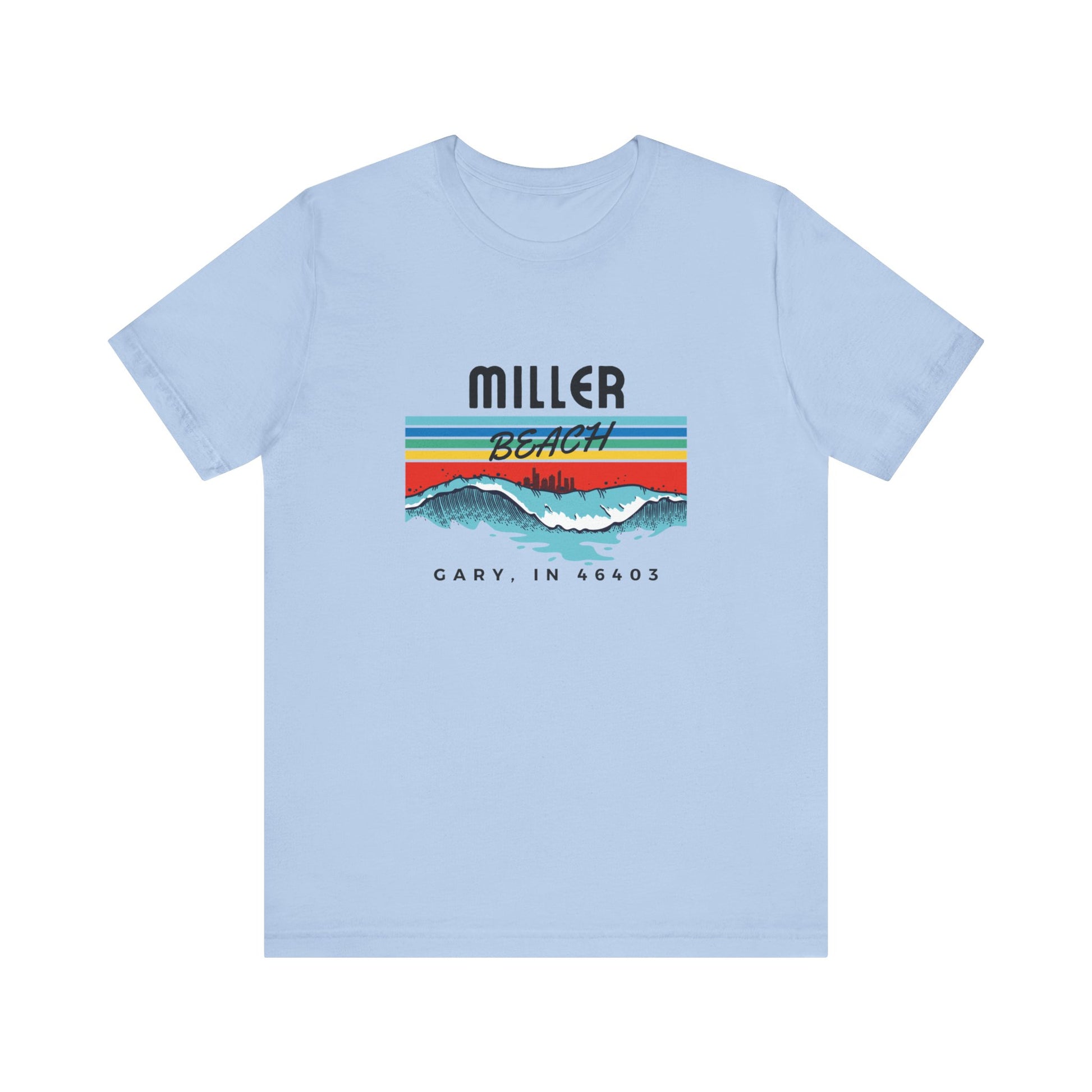 The Miller Beach 46403 Surf Style - Unisex Jersey Short Sleeve Tee by Printify features a retro surf-inspired design on a yellow background. The shirt displays "MILLER BEACH" above waves with a skyline illustration, while "Cary, IN 46403" is printed below the waves. The vibrant design also includes colorful stripes in shades of blue, red, and orange.