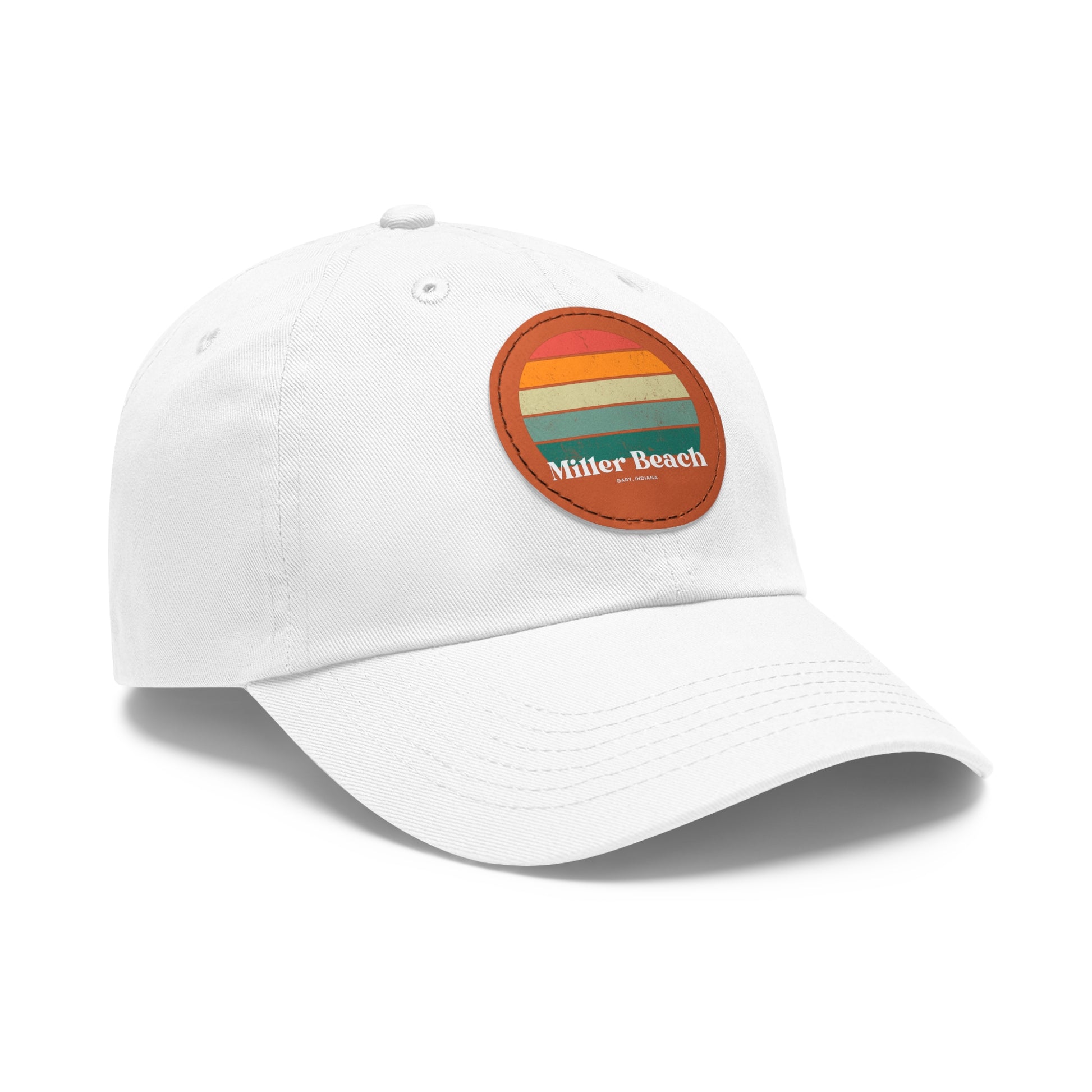 The Miller Beach Retro Sunset - Dad Hat with Leather Patch (Round) by Printify is a pink baseball cap crafted from bio-washed chino twill for added comfort. It features a PU leather patch adorned with horizontal stripes in red, orange, yellow, green, and blue. Below the stripes, "Miller Beach" is embroidered in white. An adjustable strap at the back ensures a perfect fit.