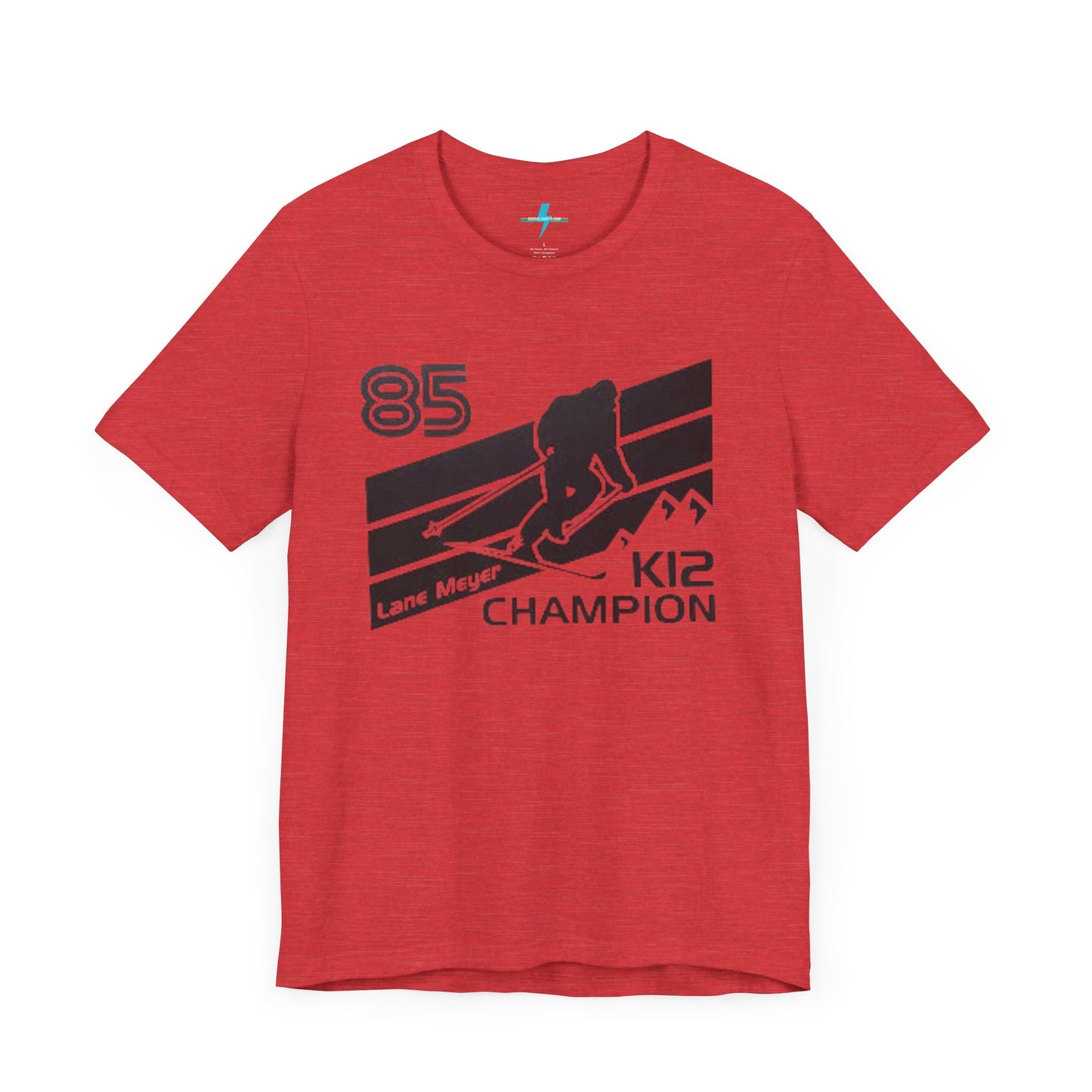 The Lane Meyer - Better off Dead - K12 Retro Unisex Jersey Short Sleeve Tee by Printify is a red 80s T-shirt featuring a black graphic design of a skier in mid-action, with "85 Lane Meyer K12 Champion" text positioned above and below the skier. The backdrop includes diagonal stripes and mountain silhouettes, perfectly capturing the iconic style from Better Off Dead.