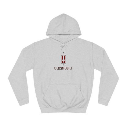 The Oldsmobile 1970s Logo - Unisex College Hoodie by Printify offers a cozy fit in white, featuring a red and black Oldsmobile logo on the front with a stylized rocket above "OLDSMOBILE." It includes a kangaroo pocket and drawstring hood for classic comfort.