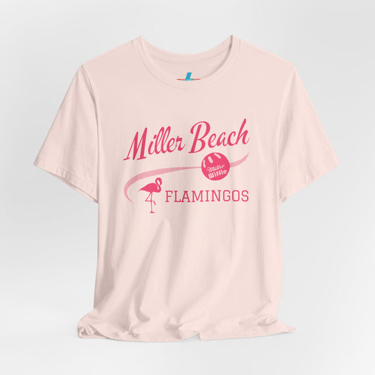 Printify offers the Miller Beach Flamingos WWBC - Unisex Jersey Short Sleeve Tee, featuring a light pink T-Shirt adorned with "Miller Beach Flamingos" and a volleyball graphic in pink. This design also includes an illustration of a flamingo, celebrating their participation in the World Wiffel Ball Championship. The shirt is showcased against a minimalist, white backdrop.