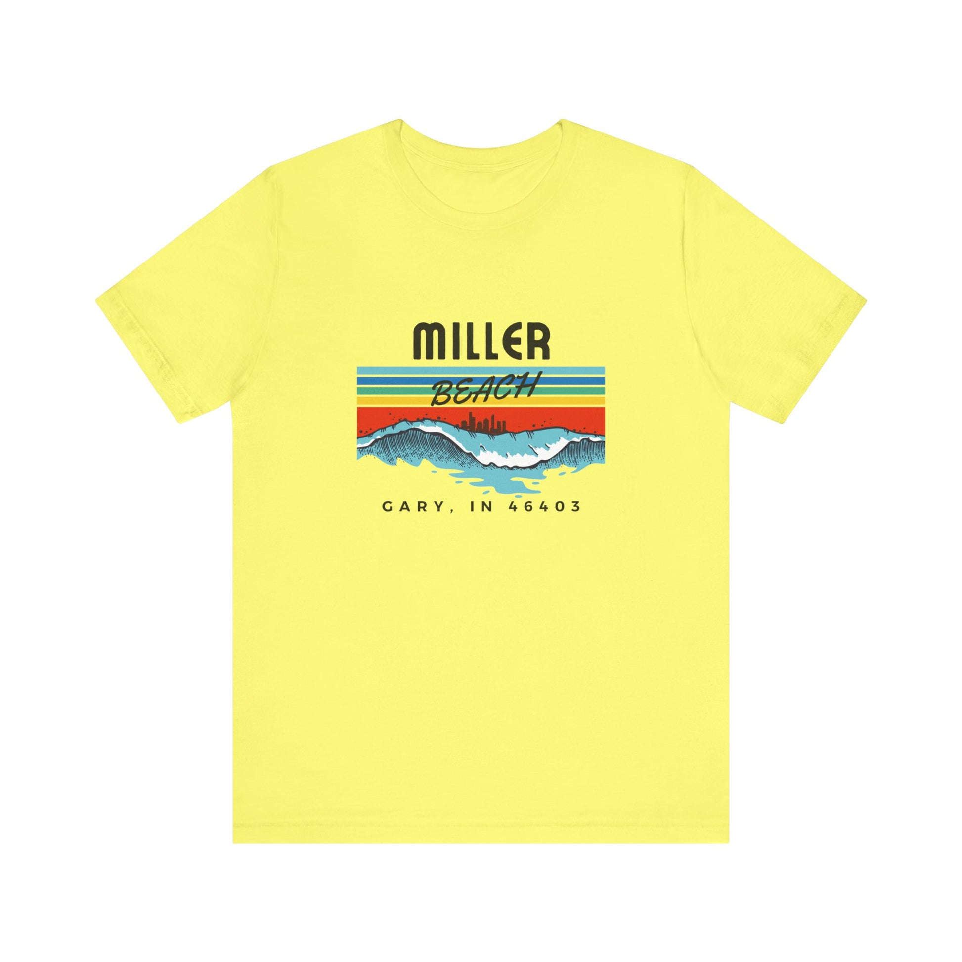 The Miller Beach 46403 Surf Style - Unisex Jersey Short Sleeve Tee by Printify features a retro surf-inspired design on a yellow background. The shirt displays "MILLER BEACH" above waves with a skyline illustration, while "Cary, IN 46403" is printed below the waves. The vibrant design also includes colorful stripes in shades of blue, red, and orange.