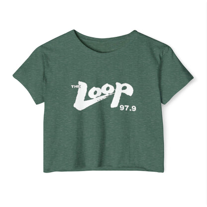 Printify's Women's Festival Crop Top features a grey design with short sleeves and a round neckline. The crop top displays the text "The Loop 97.9" in white, with the word "Loop" styled in a brushstroke-like font—ideal for fans of Chicago’s iconic rock radio station who appreciate retro fashion.