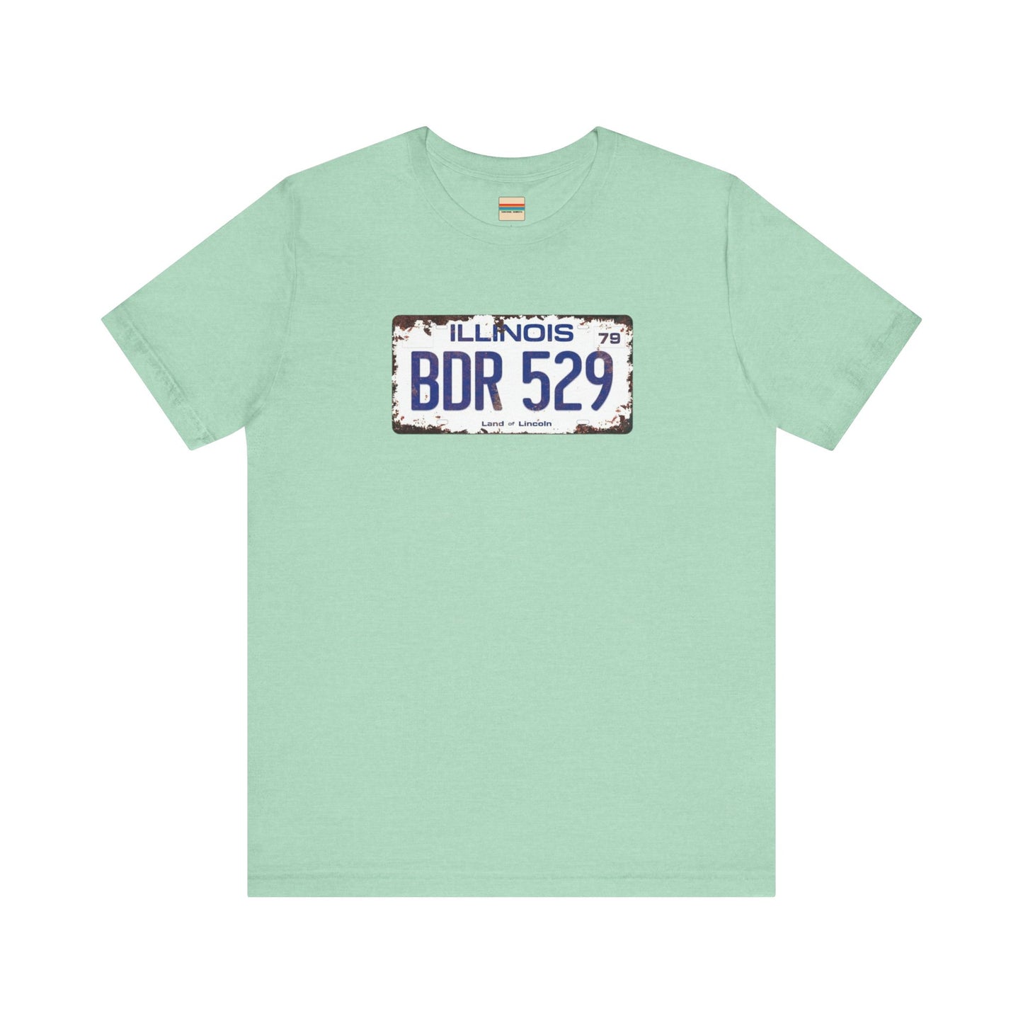 The Printify Blues Brothers BDR 529 License Plate Unisex Jersey Short Sleeve Tee showcases a vintage Illinois license plate graphic with "BDR 529" prominently displayed, as famously seen in the Blues Brothers film. The design includes "Illinois" and "Land of Lincoln" above and below the numbers, with a weathered, rustic look that enhances its retro appeal.