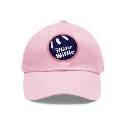 A gray dad hat by Printify, crafted from bio-washed chino twill, featuring a circular blue and white leather patch on the front. The patch showcases a baseball design with "Miller Wiffle" written in cursive font.