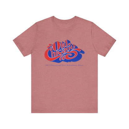 The "Old Chicago Mall Bolingbrook 1980s Retro - Unisex Jersey Short Sleeve Tee" from Printify is a gray T-shirt showcasing a vintage design with the text "Old Chicago" in blue and red. Beneath the main text, the address "355 S. Bolingbrook Drive, Bolingbrook, Illinois" appears in smaller font, evoking 80s nostalgia of the Old Chicago Mall. The shirt is displayed against a white background.