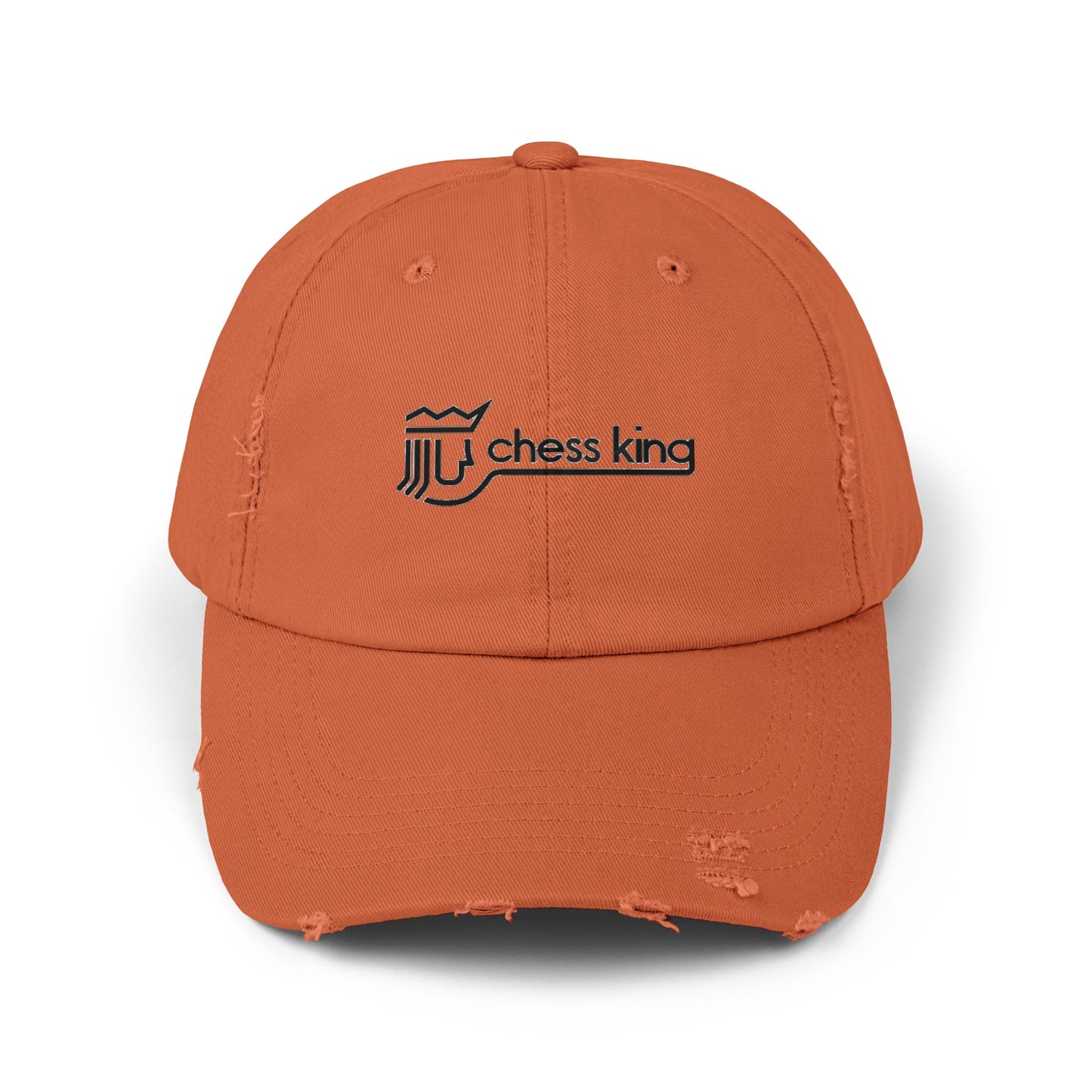 The 1980s Chess King Clothing Store Logo - Unisex Distressed Cap by Printify is a beige baseball cap made from 100% cotton twill. It features intentional distress details and a logo with a crown and rook piece, along with the text "chess king" embroidered on the front, making it a stylish choice for custom caps enthusiasts.