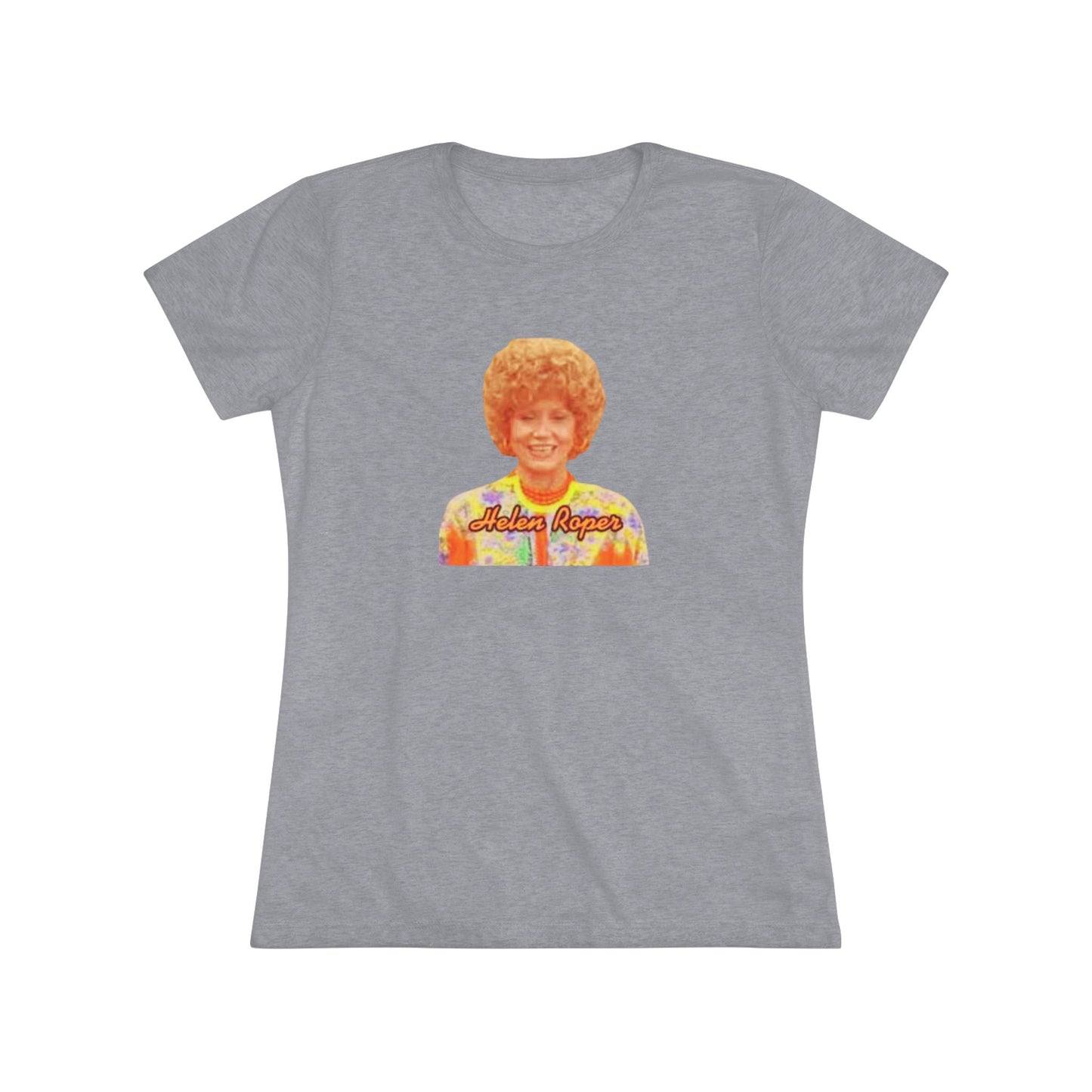 A Women's Triblend Tee by Printify, titled "Helen Roper - Three's Company," features a red design with an illustration of a smiling person with curly hair and colorful clothing. Below the illustration, the text "Helen Roper" is written in a bold, retro font, capturing the essence of vintage TV humor.