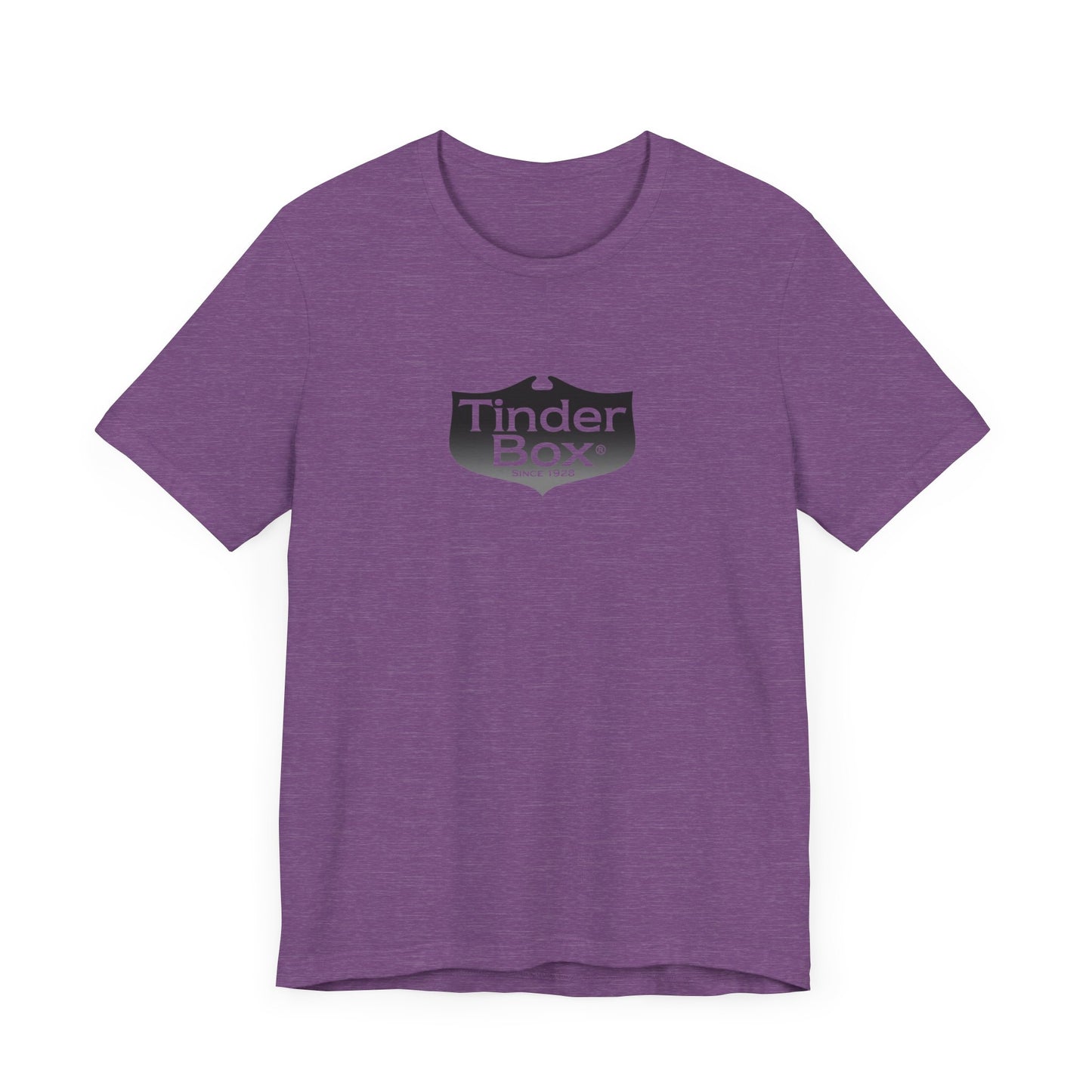 A light blue Printify "The Tinder Box 1980s" unisex jersey short sleeve tee featuring the "Tinder Box" logo in the center. The logo consists of a dark shield with the words "Tinder Box" in white text, with a small flame icon replacing the dot above the "i".