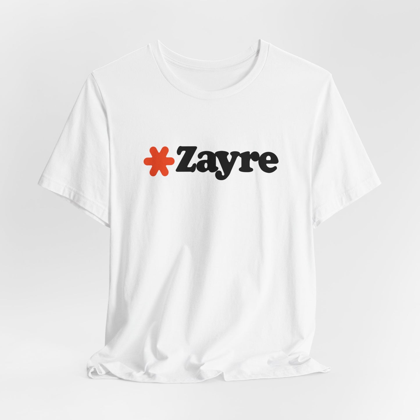 The Zayre Stores Logo - Retro 1980s Unisex Jersey Short Sleeve Tee by Printify features a gray design with the word "Zayre" printed in black letters and a red asterisk preceding the text. Reminiscent of retro fashion from the Zayre 1980s Retail Store, this shirt is displayed against a minimalistic white background and appears to be made of soft, comfortable fabric.