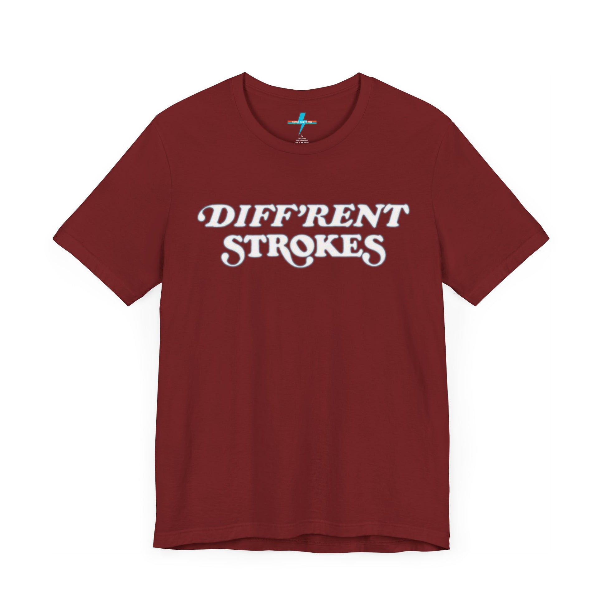 A burnt orange "Diff’Rent Strokes - Retro 1980s" unisex jersey short sleeve tee by Printify, featuring the phrase "DIFF'RENT STROKES" in bold, white cursive letters across the chest. The plain white backdrop perfectly showcases this nostalgic TV apparel.