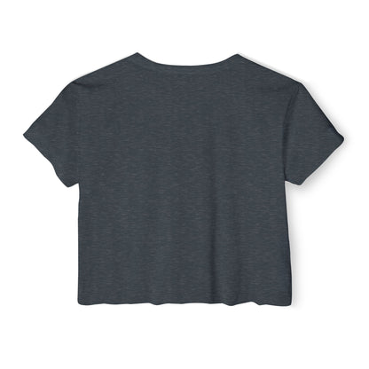 A grey, short-sleeve, rounded-neckline Women's Festival Crop Top by Printify, featuring "IROC-Z" printed in bold black letters across the chest. Perfect for any festival, this Chevrolet Iroc Z-inspired top from the 1980s stands out against a plain white background.