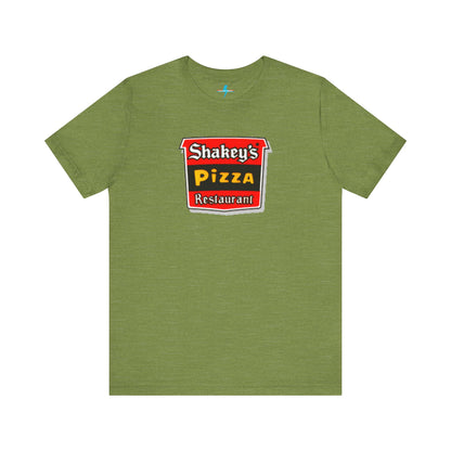 A black Shakey's Pizza - 1980s Retro Logo - Unisex T-Shirt by Printify hangs against a white background. The shirt features a colorful graphic with the text "Shakey's Pizza Restaurant" in white, yellow, and black lettering on a red background, resembling vintage pizza joints signage. This retro tee brings nostalgic vibes of classic pizzerias.