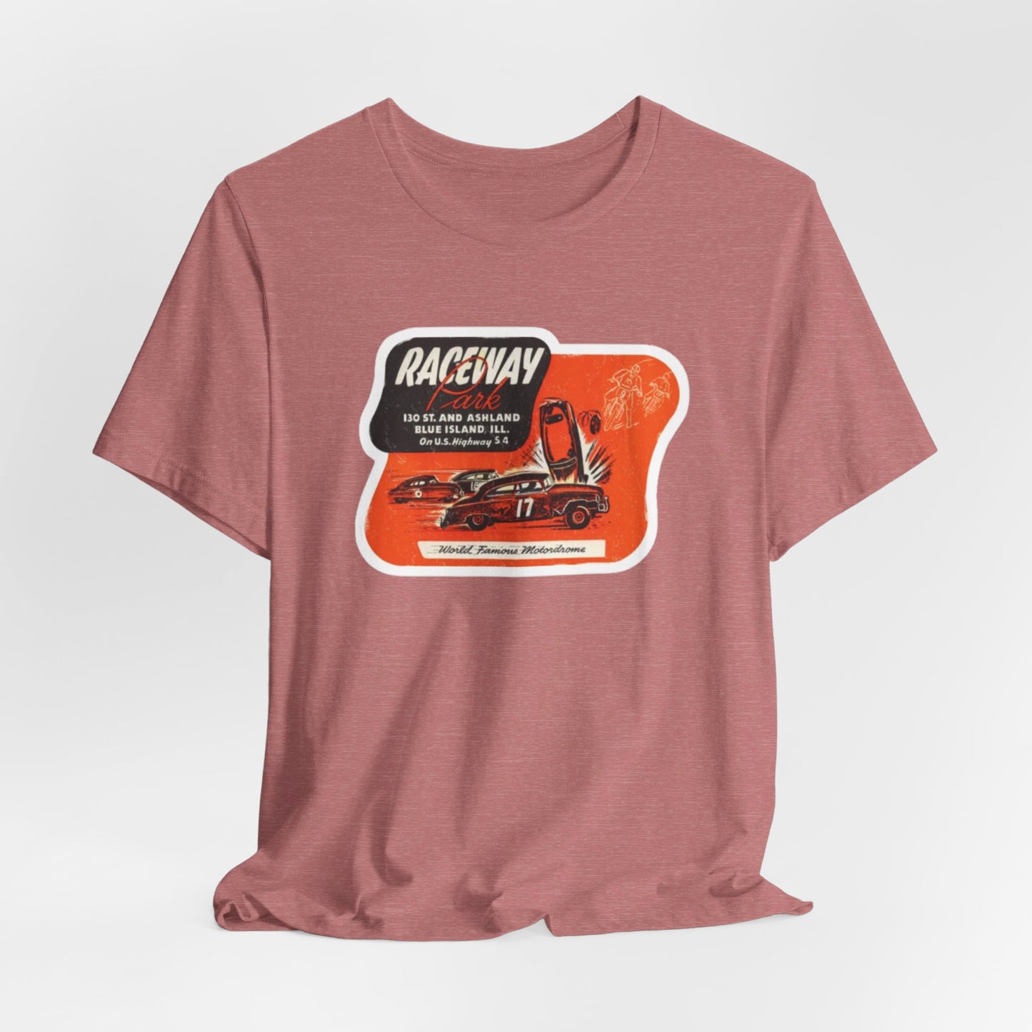 The 1970's Raceway Park - Blue Island, IL - Unisex Jersey Short Sleeve Tee by Printify is a light gray T-shirt featuring a graphic with a red background, an illustration of a race car labeled "17," and text reading "RACEWAY" and "As Seen On." The vintage-inspired design offers a nostalgic nod to classic car enthusiasts, reminiscent of the '70s racing era. The shirt is displayed against a plain background.