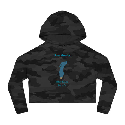 The "Just the Tip - Miller Beach - Women’s Cropped Hooded Sweatshirt" by Printify is designed in black camo with high-quality tri-blend fabric, showcasing a blue map shape and a yellow star. It features the phrase "Killer Beach" along with references to "Gary, IN," embodying the spirit of Miller Beach adventures.