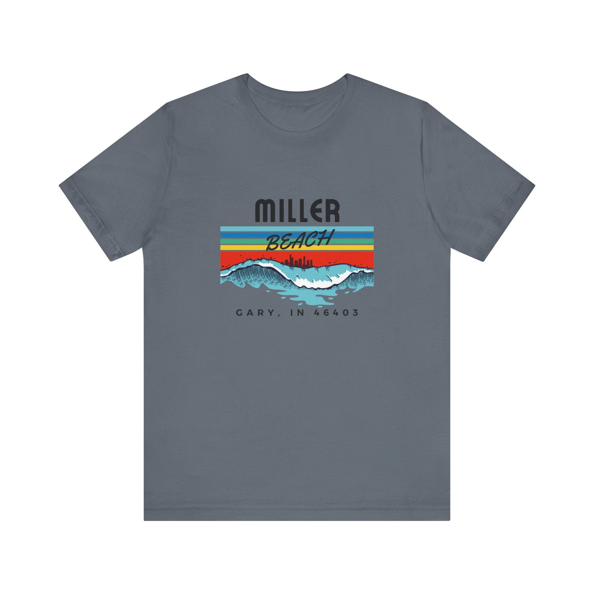 The Miller Beach 46403 Surf Style - Unisex Jersey Short Sleeve Tee by Printify features a retro surf-inspired design on a yellow background. The shirt displays "MILLER BEACH" above waves with a skyline illustration, while "Cary, IN 46403" is printed below the waves. The vibrant design also includes colorful stripes in shades of blue, red, and orange.