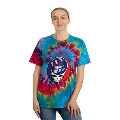 Introducing the Miller Wiffel Ball Stealy - Tie-Dye Tee, Spiral - Unisex by Printify. This vibrant tie-dye t-shirt features a swirl of blue, green, red, yellow, and purple colors in a classic spiral pattern. Made from 100% pre-shrunk cotton, it boasts a striking graphic at the center: a white skull wearing a baseball hat with the text "Miller Wiffle" on a red and blue background.