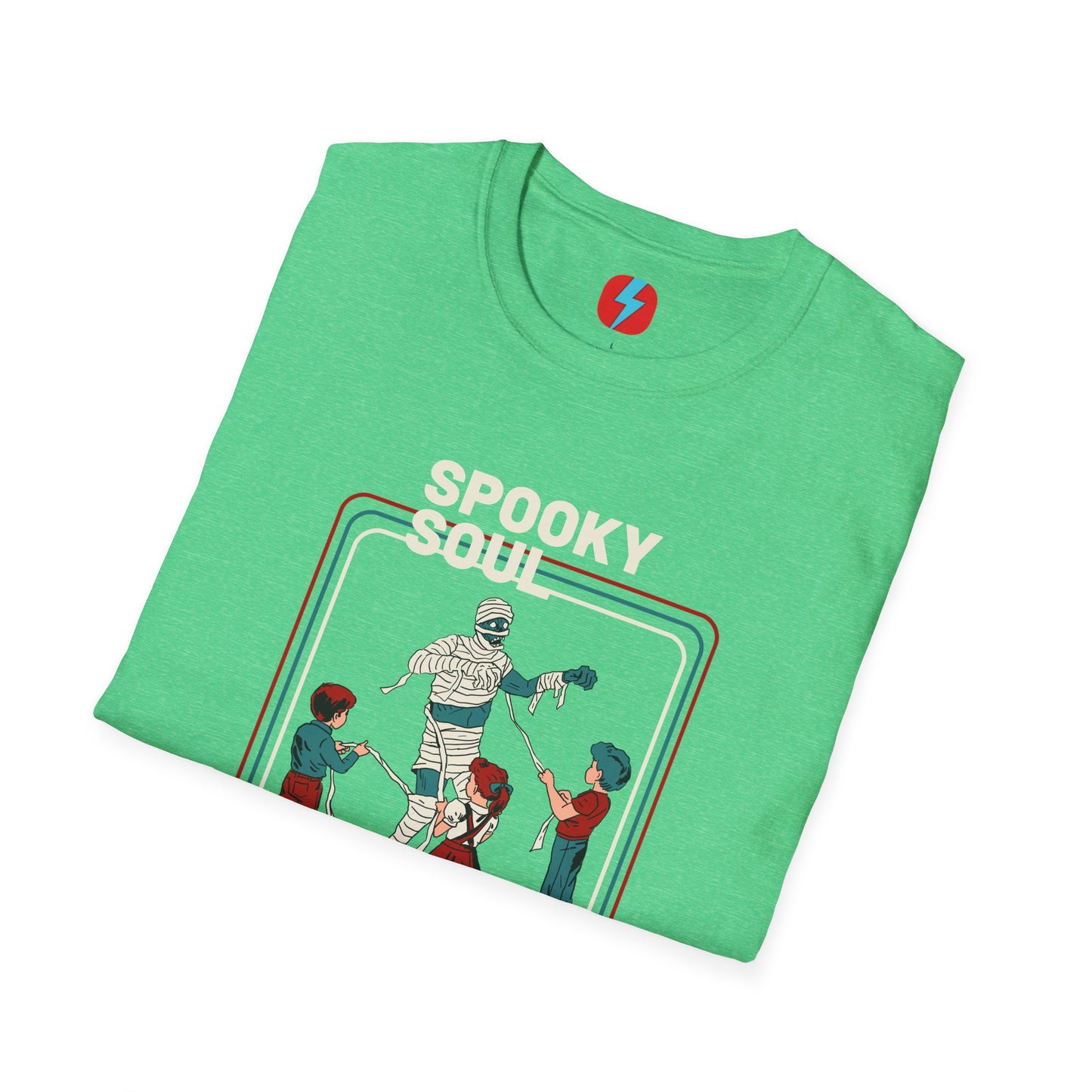 The Spooky Soul - Halloween - Unisex Softstyle T-Shirt by Printify, available in dark gray, showcases a retro-style graphic of a mummy dancing with two kids in Halloween costumes. The text "SPOOKY SOUL" is displayed above the image, which is framed by red and blue lines to enhance its vintage feel.