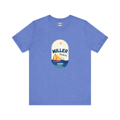 The Miller Beach Sailboat - Unisex Jersey Short Sleeve Tee by Printify features a vibrant graphic design portraying a sailboat on water with a sun above it and the text "MILLER beach 46403." This white retail fit shirt is crafted from soft Airlume combed cotton and showcases rounded graphics in blue, orange, and yellow.