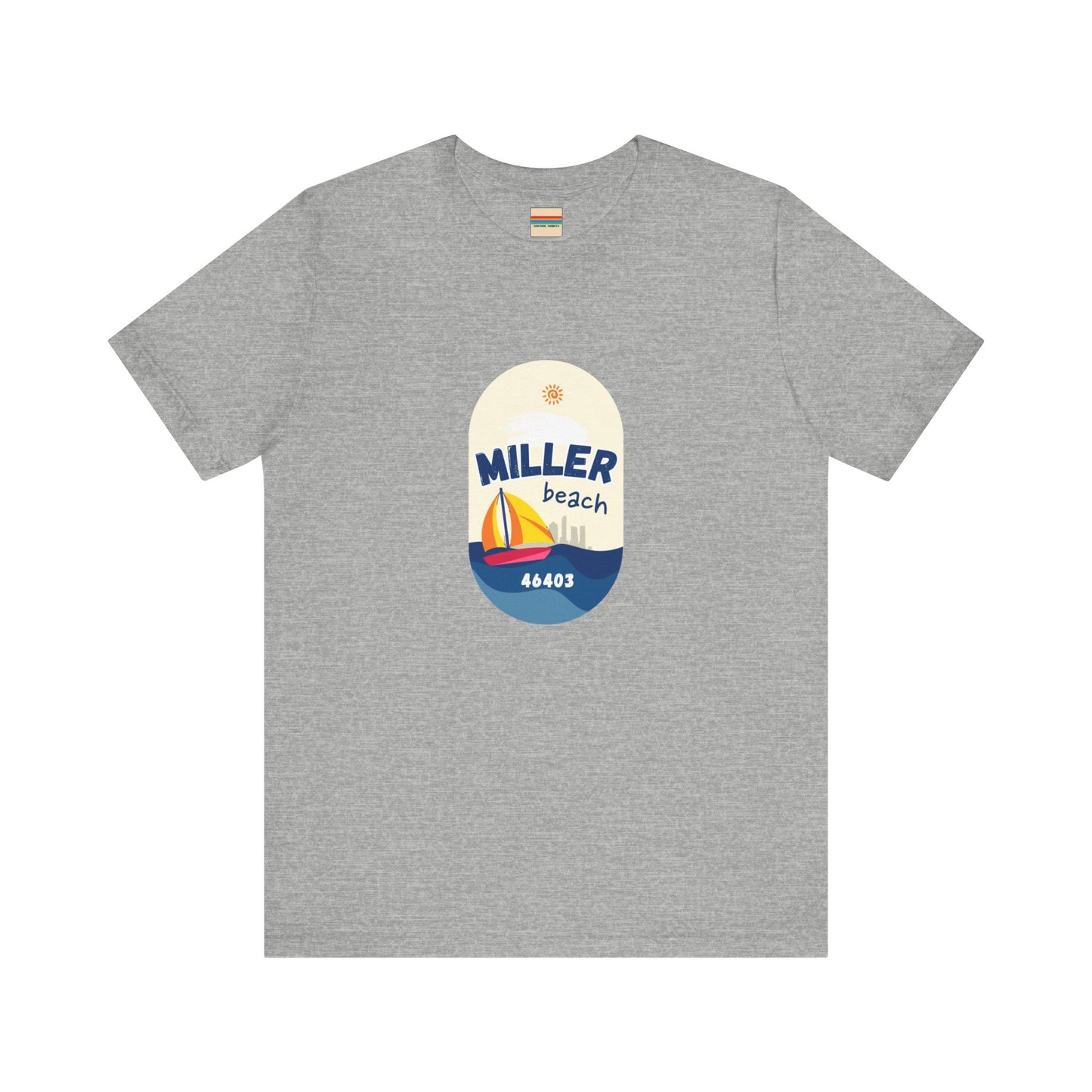 The Miller Beach Sailboat - Unisex Jersey Short Sleeve Tee by Printify features a vibrant graphic design portraying a sailboat on water with a sun above it and the text "MILLER beach 46403." This white retail fit shirt is crafted from soft Airlume combed cotton and showcases rounded graphics in blue, orange, and yellow.