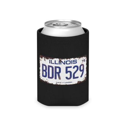 Printify's Blues Brothers - BDR 529 - Koozie is a black beverage can cooler that features a vintage Illinois license plate with "BDR 529" and "Land of Lincoln" on its front, evoking a road-trip vibe. At the bottom, a red circle with a blue lightning bolt symbol completes this stylish koozie.