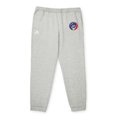 Adidas Unisex Fleece Joggers from Printify, featuring a gray design with an embroidered basketball and hoop logo on the upper left leg, made from sustainable materials for ultimate comfort and style.