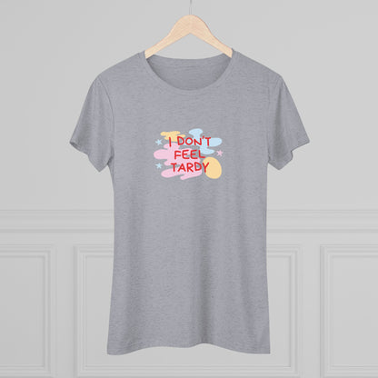 A light gray, short-sleeved Women's Triblend Tee from Printify with the playful phrase "I DON'T FEEL TARDY" printed in colorful letters on the front. The text is surrounded by abstract pastel shapes, giving it retro vibes and a vintage look reminiscent of a Van Halen T-shirt.