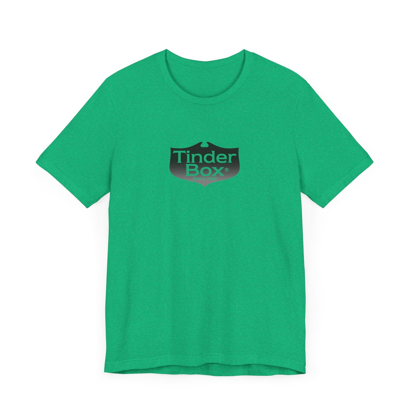A light blue Printify "The Tinder Box 1980s" unisex jersey short sleeve tee featuring the "Tinder Box" logo in the center. The logo consists of a dark shield with the words "Tinder Box" in white text, with a small flame icon replacing the dot above the "i".