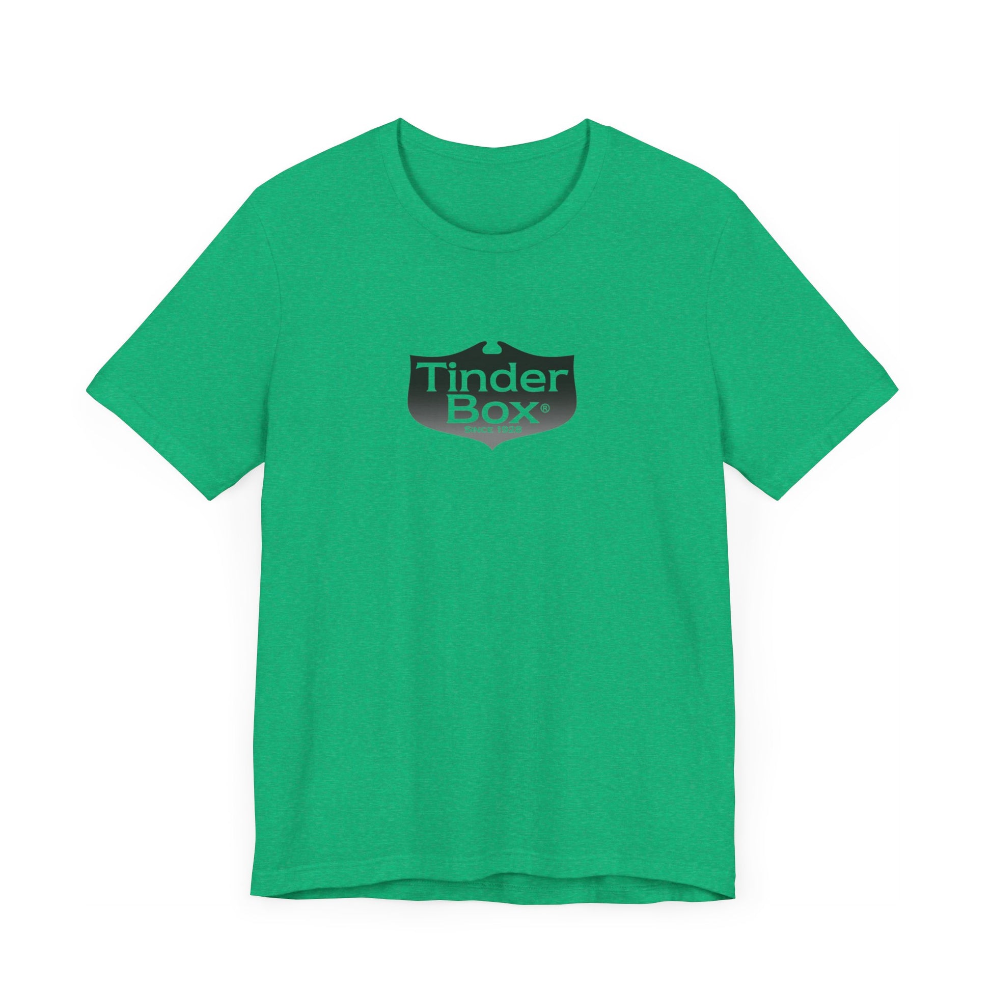 A light blue Printify "The Tinder Box 1980s" unisex jersey short sleeve tee featuring the "Tinder Box" logo in the center. The logo consists of a dark shield with the words "Tinder Box" in white text, with a small flame icon replacing the dot above the "i".