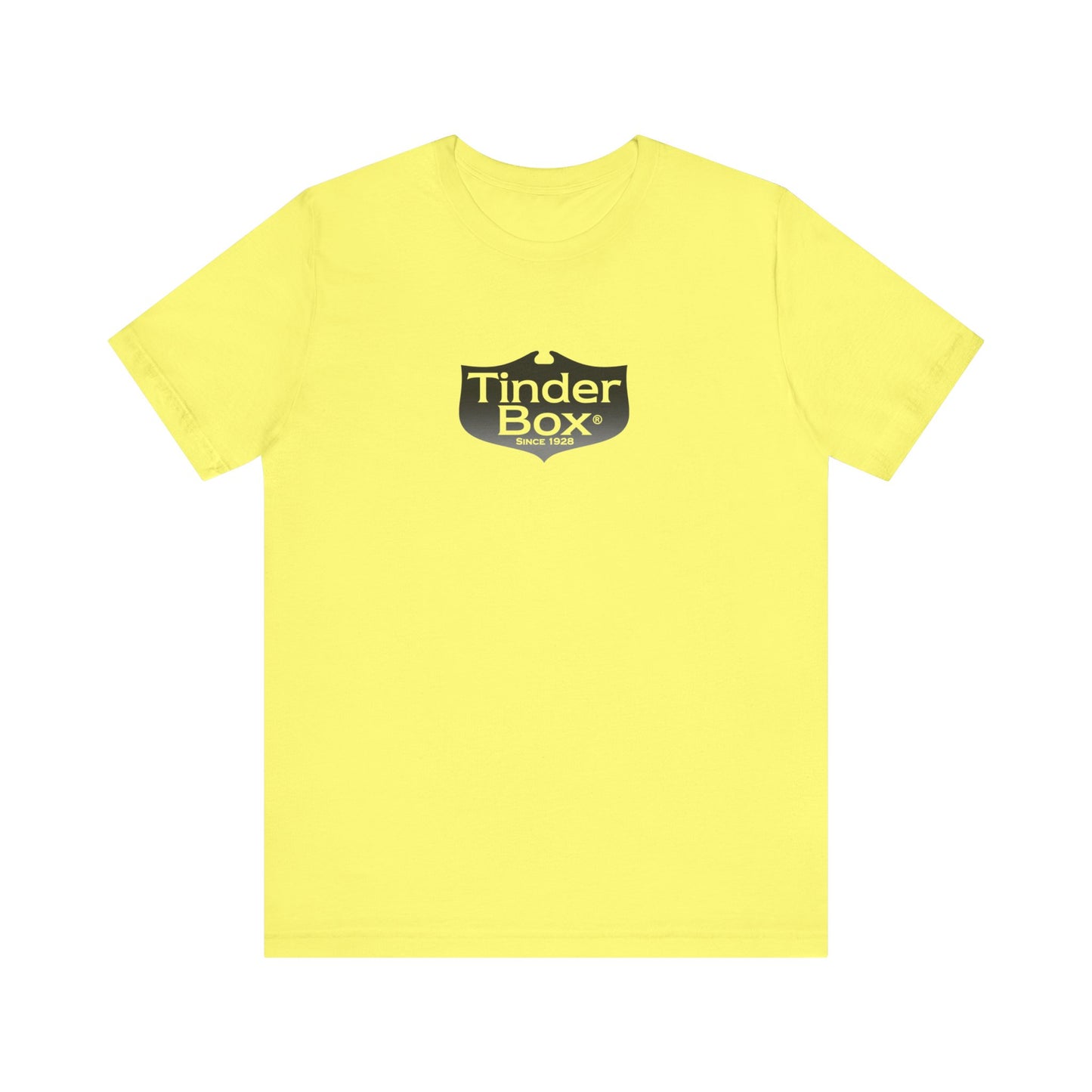 A light blue Printify "The Tinder Box 1980s" unisex jersey short sleeve tee featuring the "Tinder Box" logo in the center. The logo consists of a dark shield with the words "Tinder Box" in white text, with a small flame icon replacing the dot above the "i".