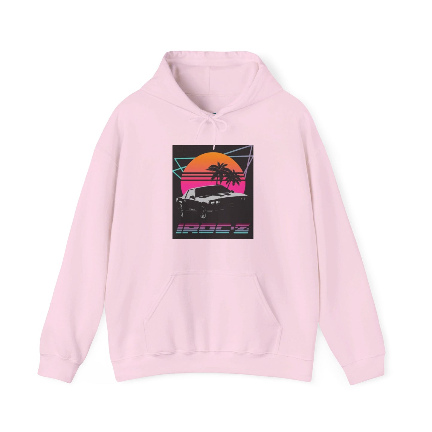 Introducing the Chevrolet IRoc Z28 - 1980s Retro Hoodie by Printify: This vibrant pink hoodie showcases a striking retro design on the front, featuring a classic American muscle car set against an orange and red sunset with palm trees, intersected by geometric shapes. The text "IROCZ" is prominently displayed below the image. Offering a relaxed fit and equipped with a front pocket, this hoodie perfectly captures the essence of 1980s style.