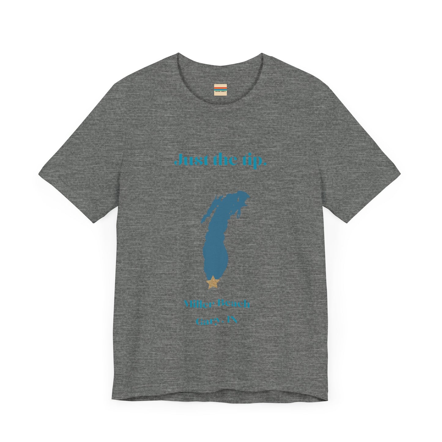 The Just the Tip - Miller Beach Unisex Jersey Short Sleeve Tee by Printify in yellow showcases text and a graphic design. The top displays "Just the tip" above a blue silhouette reminiscent of Indiana. At the bottom, it reads "Miller Beach" and "Gary, IN." Made from soft Airlume combed cotton, this tee offers both comfort and style.