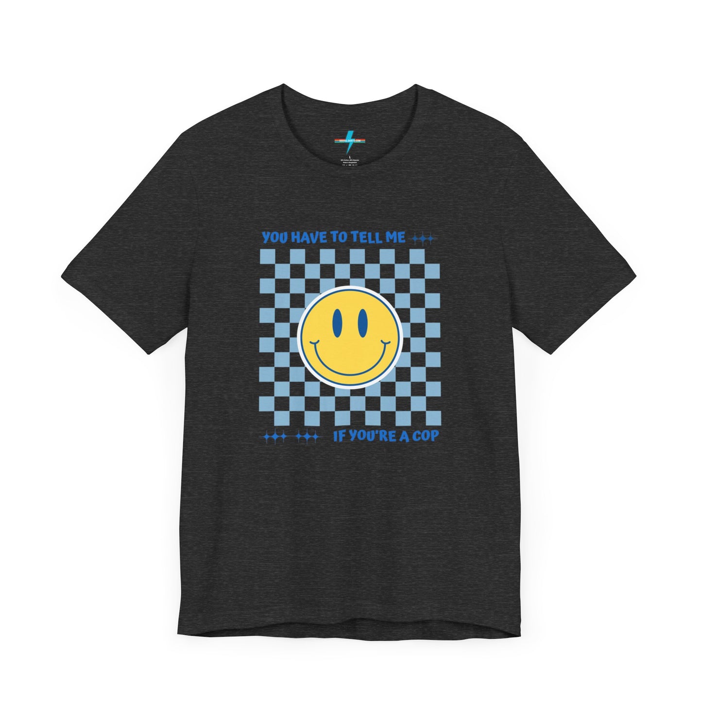 A light yellow unisex jersey short sleeve tee from Printify featuring a blue and yellow checkerboard pattern with a large yellow smiley face in the center. The shirt displays blue text above and below the pattern that reads, "You have to tell me if you're a cop." It's made from 100% Airlume combed and ring-spun cotton.