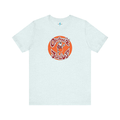 The Orange Julius 1980's Logo Unisex Jersey Style T-Shirt from Printify boasts a light gray color and features a vintage-style graphic. The design showcases the text "Orange Julius" in a stylized font within an orange circle, along with a small cartoon character holding a drink at the center—a nostalgic nod to timeless refreshment.