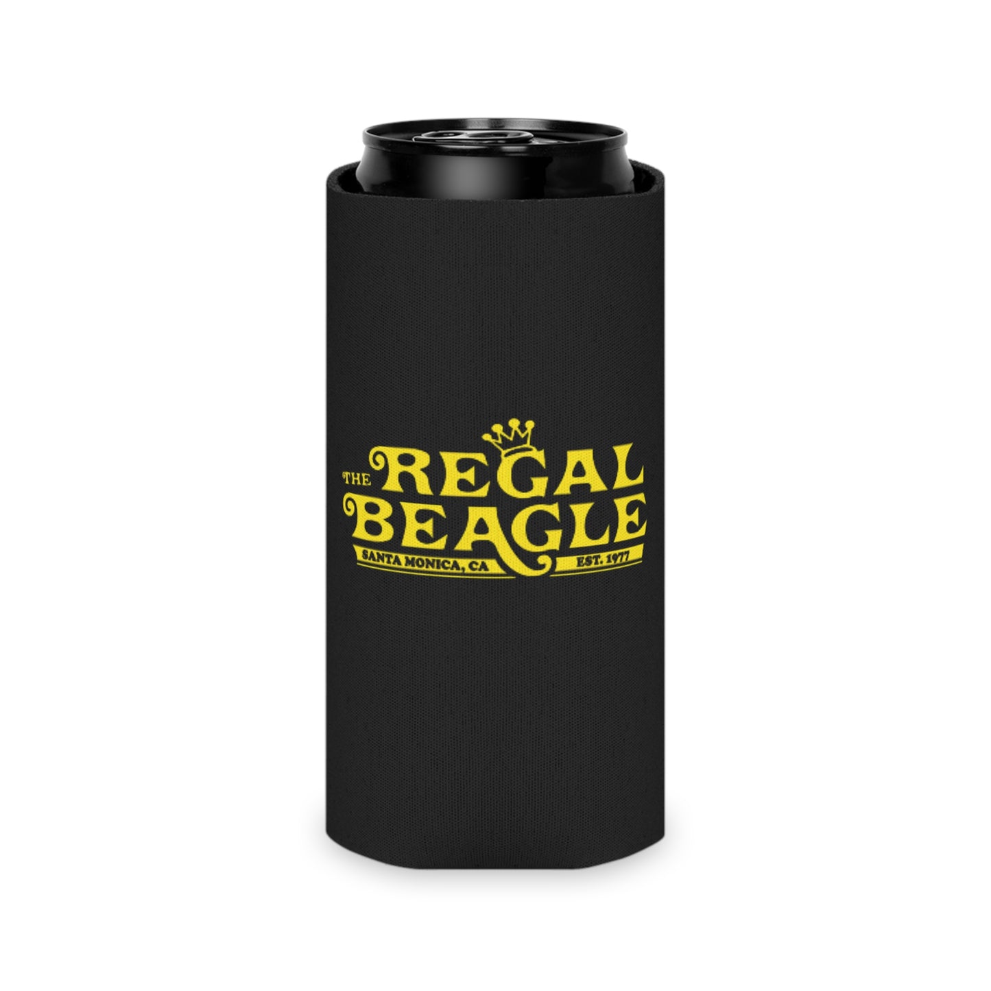 The Regal Beagle - Three's Company - Koozie by Printify features a black design with yellow text that reads "The Regal Beagle," alongside "Santa Monica, CA" and "Est. 1977." A small, partially visible URL in white and blue at the bottom reads socoolshirts.com. An ideal accessory for fans of Three’s Company!