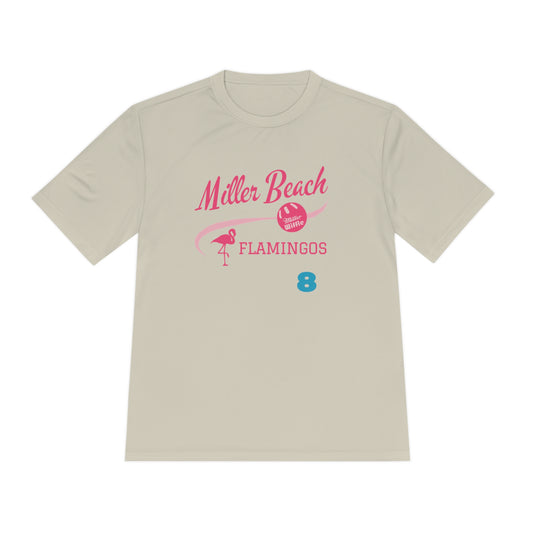 A beige Printify t-shirt from the Miller Beach Flamingos collection featuring a pink and blue design with moisture-wicking PosiCharge® technology for comfort. The text "Miller Beach" is in pink, followed by a curved line and a beach ball icon, with "Flamingos" also in pink and the number 8 in blue below. A small flamingo silhouette completes the design on this unisex tee.