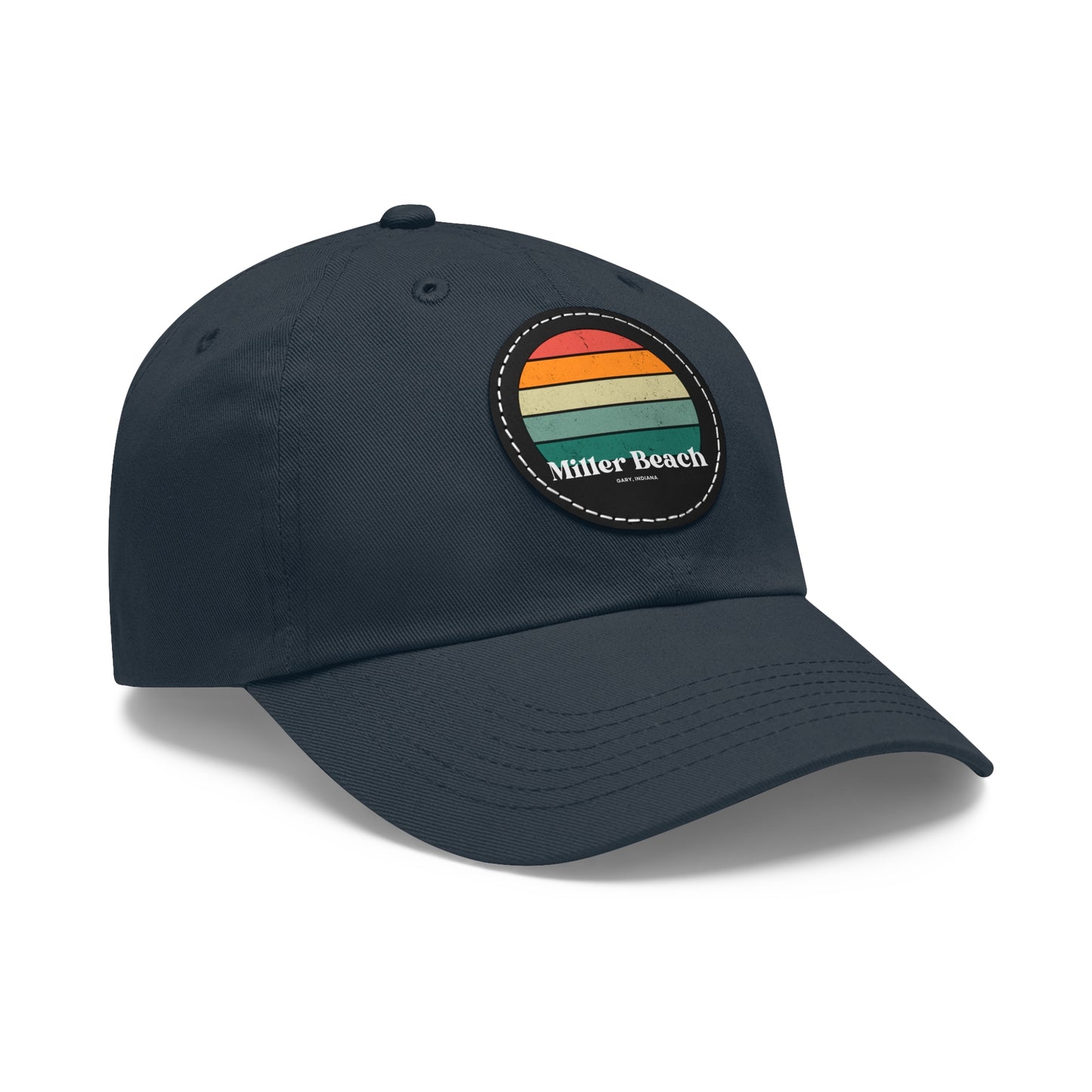 The Miller Beach Retro Sunset - Dad Hat with Leather Patch (Round) by Printify is a pink baseball cap crafted from bio-washed chino twill for added comfort. It features a PU leather patch adorned with horizontal stripes in red, orange, yellow, green, and blue. Below the stripes, "Miller Beach" is embroidered in white. An adjustable strap at the back ensures a perfect fit.