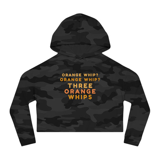 A stylish and comfortable Black Camo cropped hooded sweatshirt from Printify, this "Three Orange Whips - Blues Brothers" women's hoodie features the iconic text "Orange Whip? Orange Whip? Orange Whip? THREE ORANGE WHIPS" in bright orange letters on the front. It includes a front pocket and drawstring-adjustable hood.