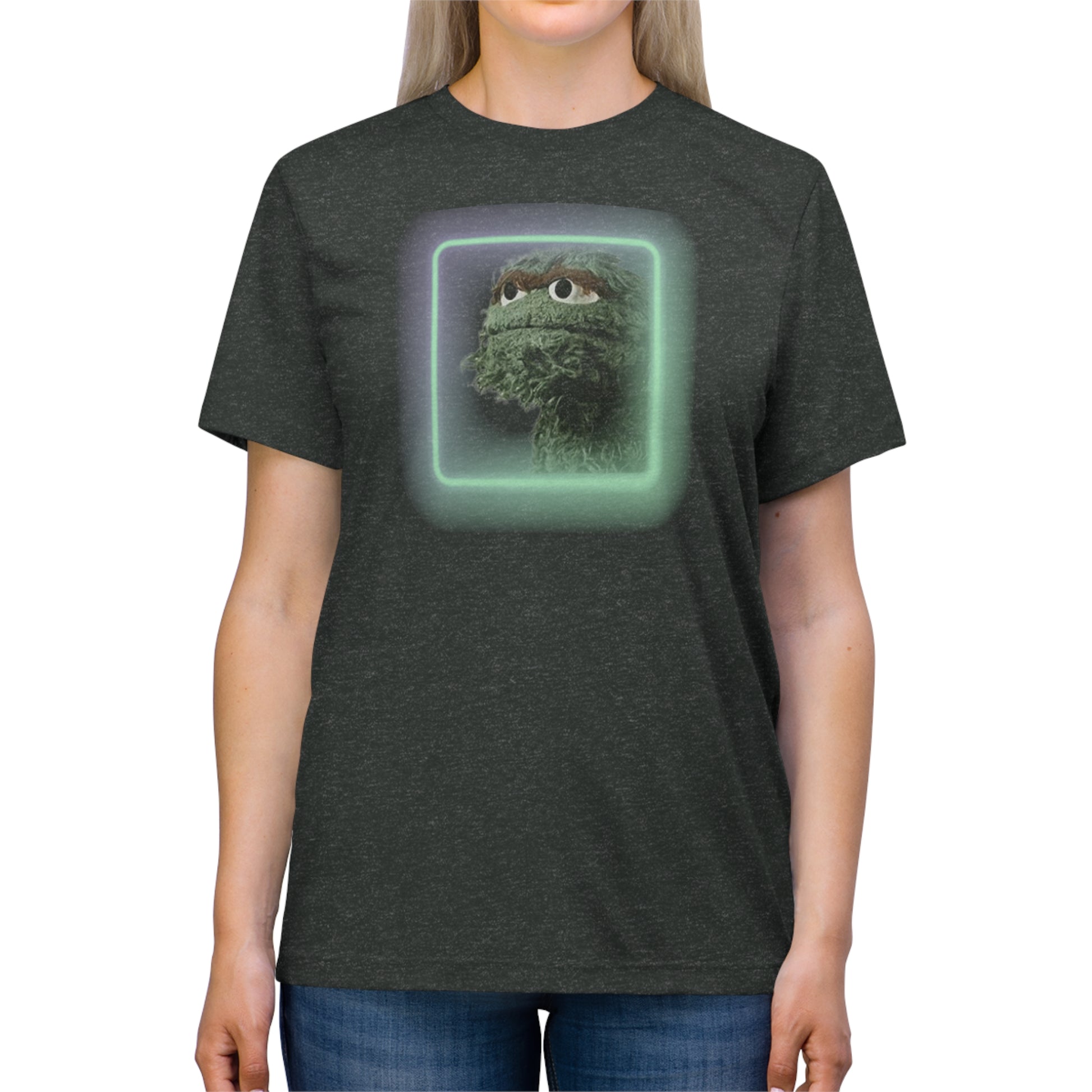 Introducing the Oscar the Grouch Unisex Triblend Tee by Printify: This red triblend t-shirt features a green puppet character with expressive eyes, framed by a glowing, square-shaped rainbow border. With its simple and casual design, free of any additional text or graphics, this tee offers the perfect blend of style and durability thanks to its polyester construction.