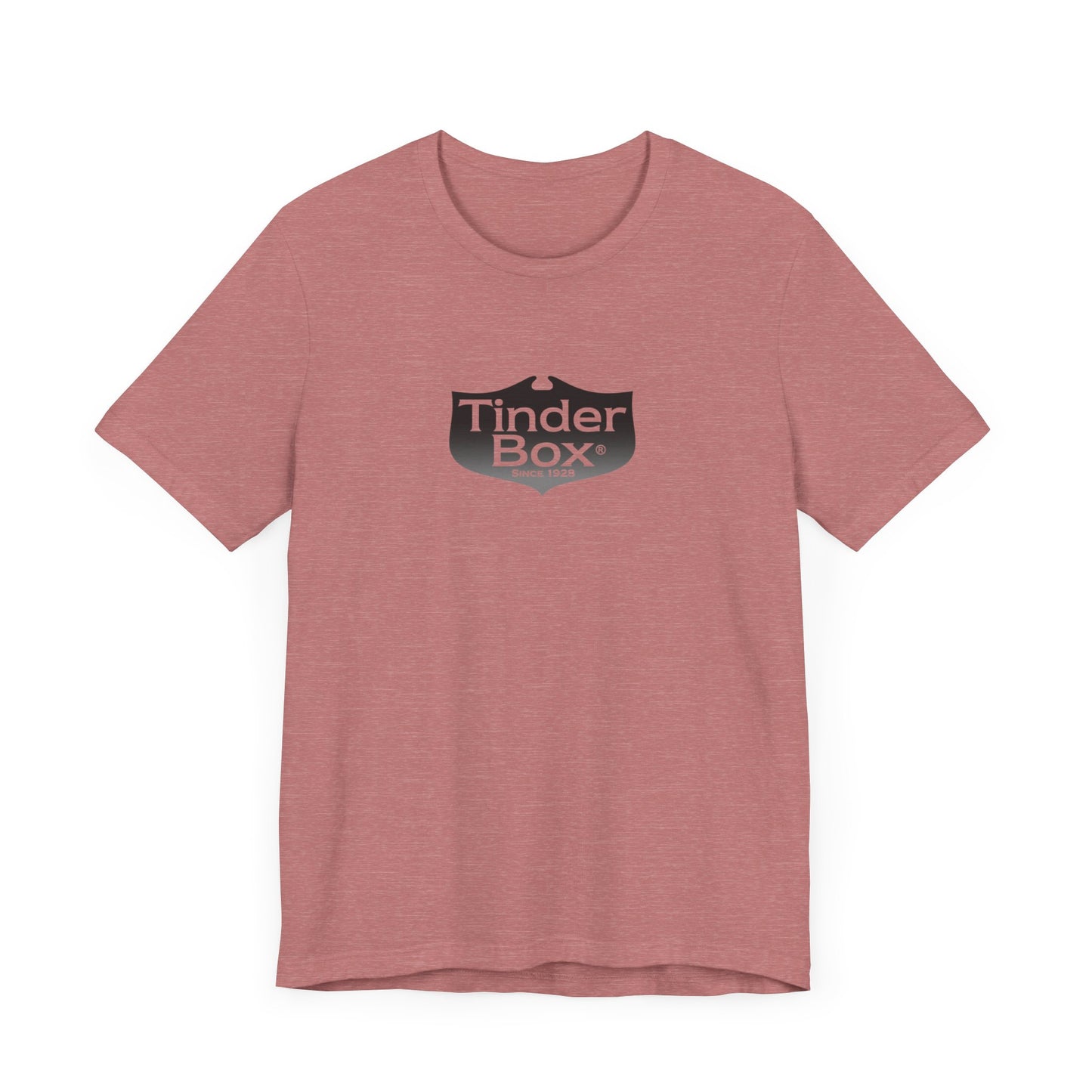 A light blue Printify "The Tinder Box 1980s" unisex jersey short sleeve tee featuring the "Tinder Box" logo in the center. The logo consists of a dark shield with the words "Tinder Box" in white text, with a small flame icon replacing the dot above the "i".